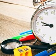 School tools. On a wooden background.